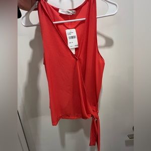 Orange sleeveless blouse - never worn size M